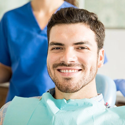 Patient Smiling after having dental procedure in Dental Care of Madison